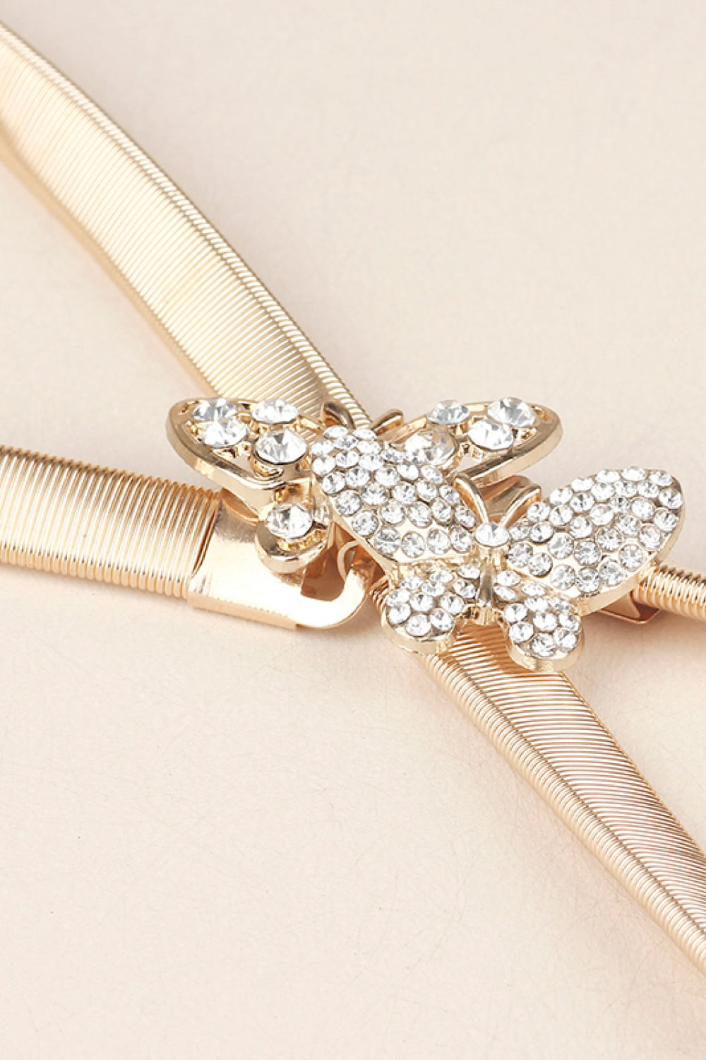 Rhinestone Butterfly Belt with golden strap and sparkling butterfly embellishments for stylish outfits.