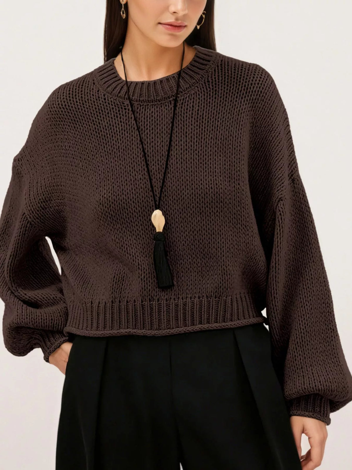 Oversized Chunky Knit Sweater worn with high-waisted jeans, showcasing cozy style and effortless fashion.