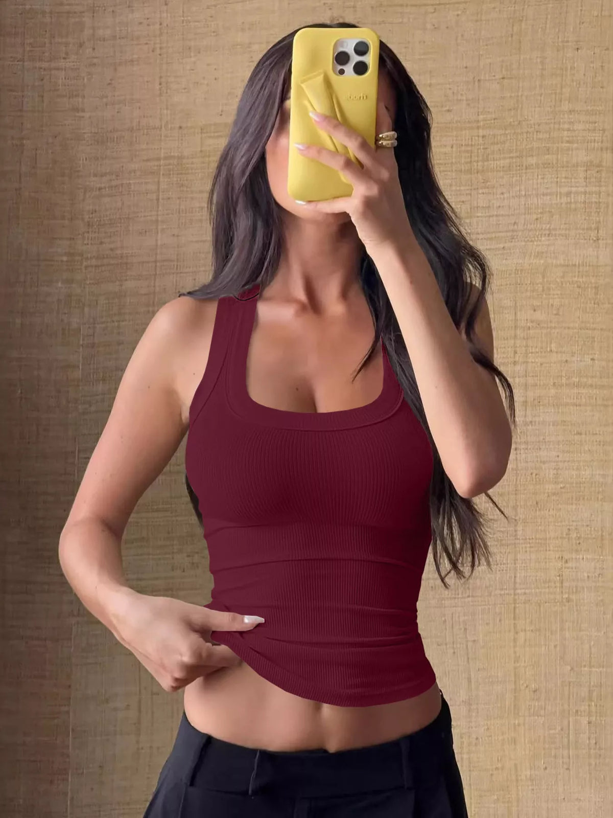 Ribbed Knit Slim Fit Tank Top in burgundy, showcasing stylish stretch and a flattering fit for versatile outfits.