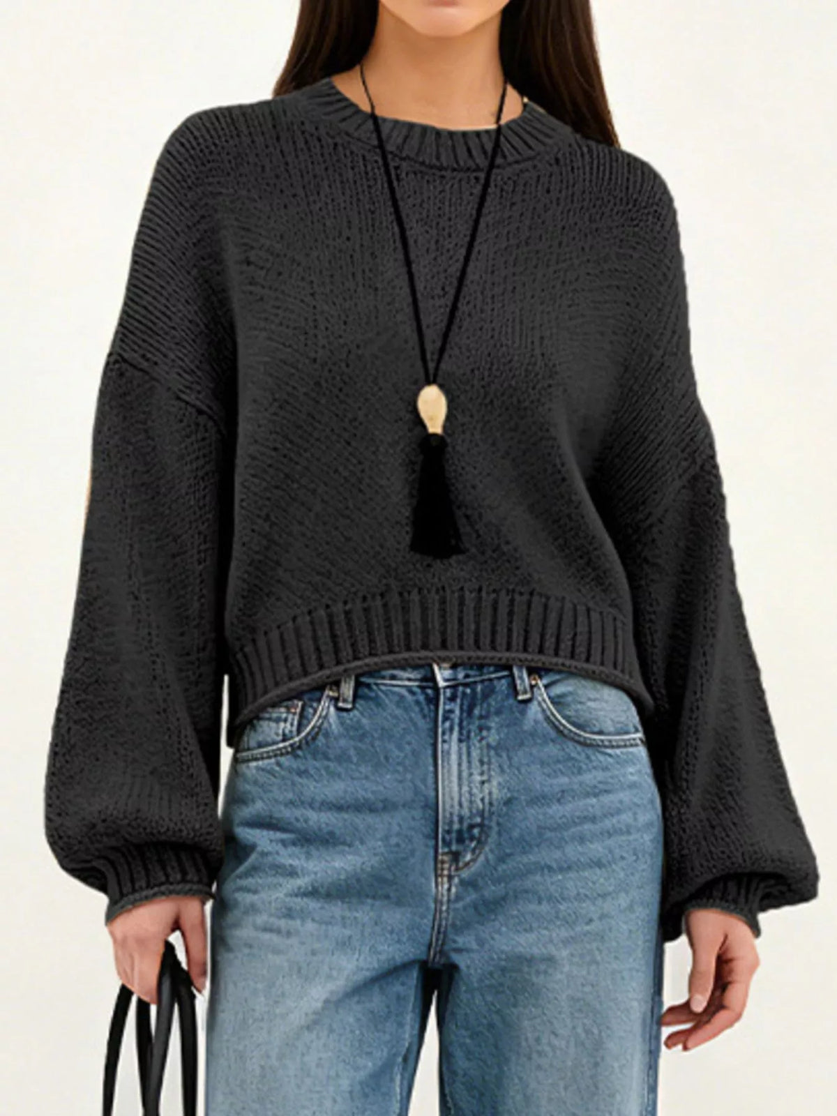Oversized Chunky Knit Sweater worn with high-waisted jeans, showcasing cozy style and effortless fashion.