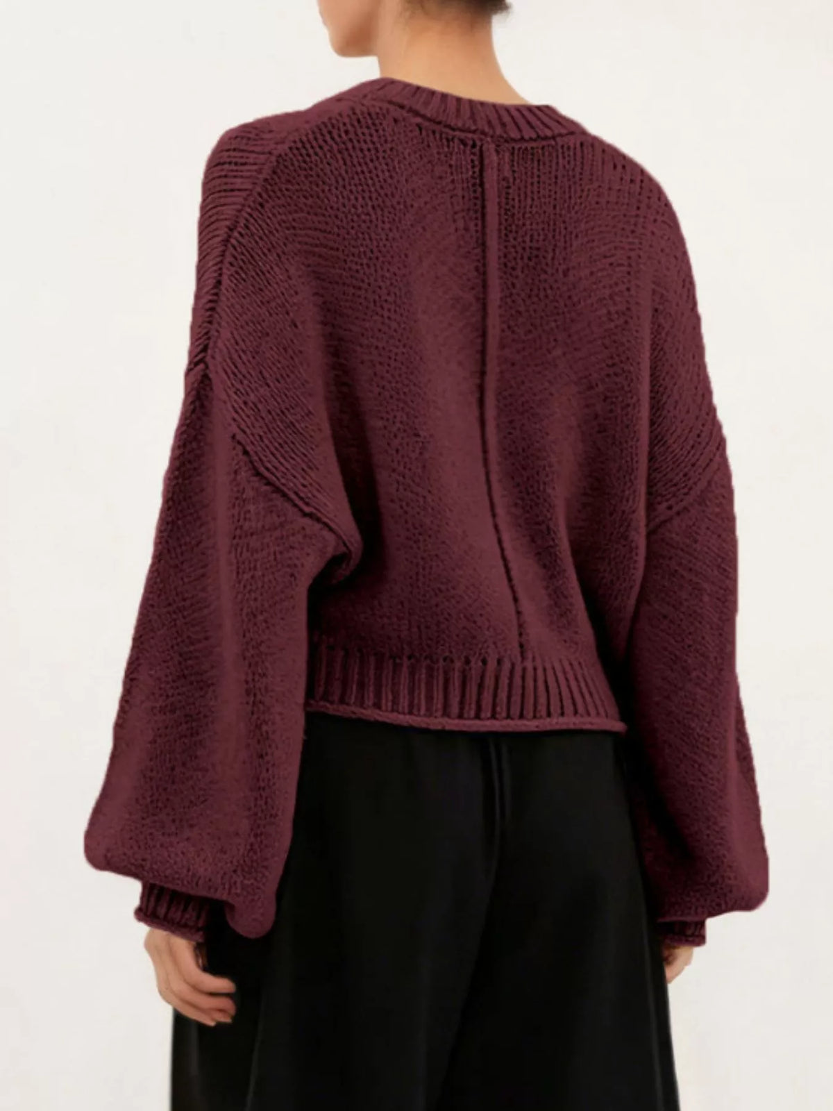 Oversized Chunky Knit Sweater worn with high-waisted jeans, showcasing cozy style and effortless fashion.