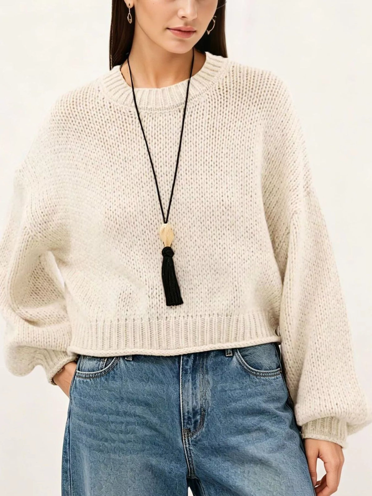 Oversized Chunky Knit Sweater worn with high-waisted jeans, showcasing cozy style and effortless fashion.