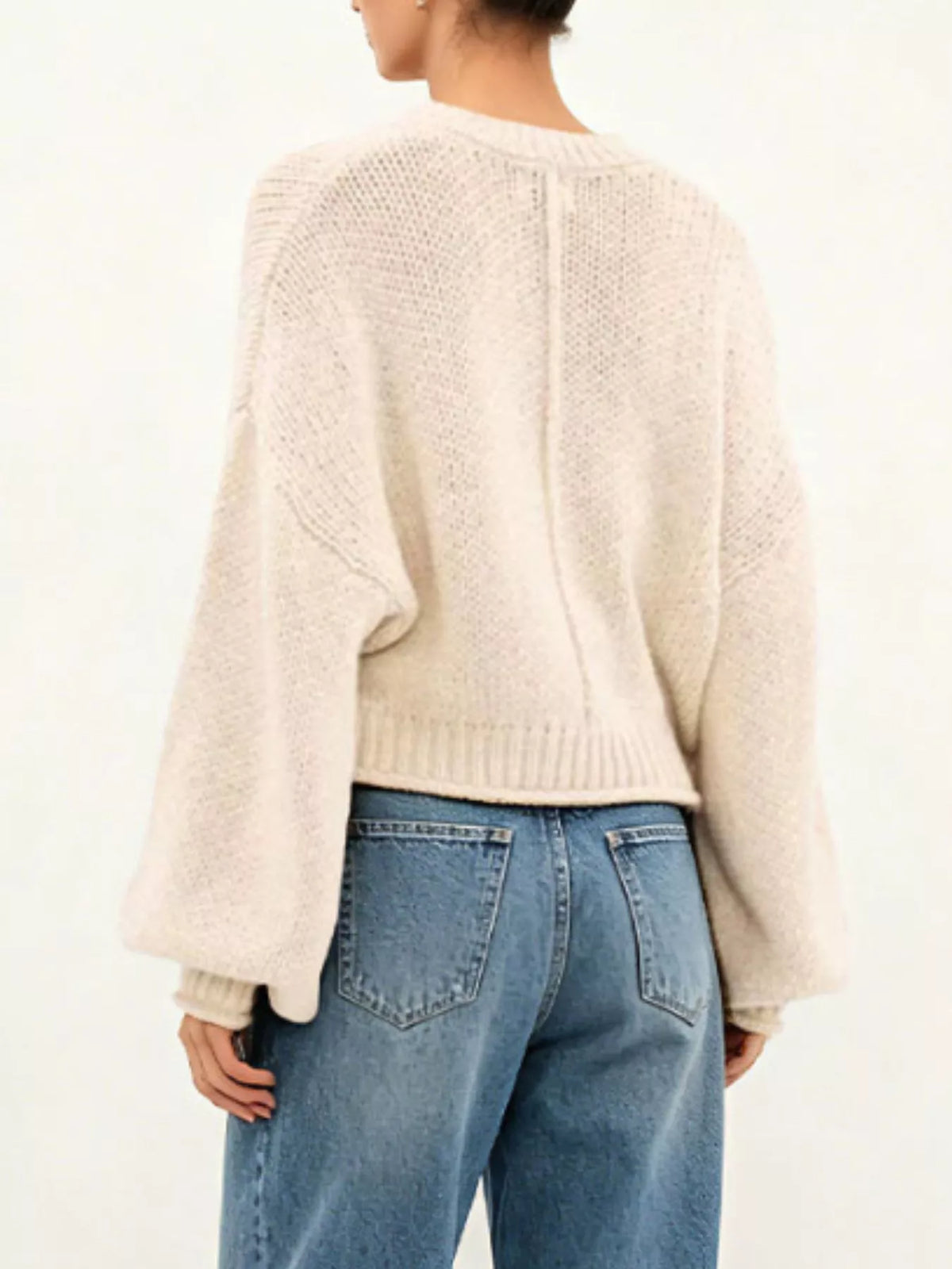 Oversized Chunky Knit Sweater worn with high-waisted jeans, showcasing cozy style and effortless fashion.