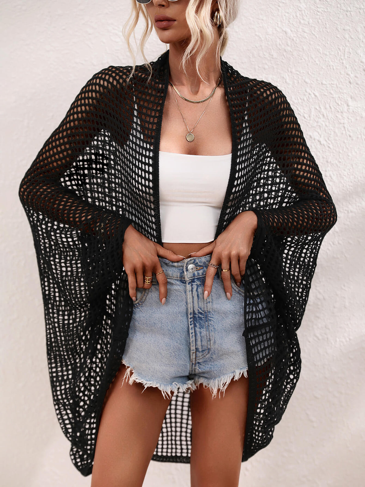 Openwork Longline Cover Up worn over a crop top and shorts, showcasing its stylish sheer design.