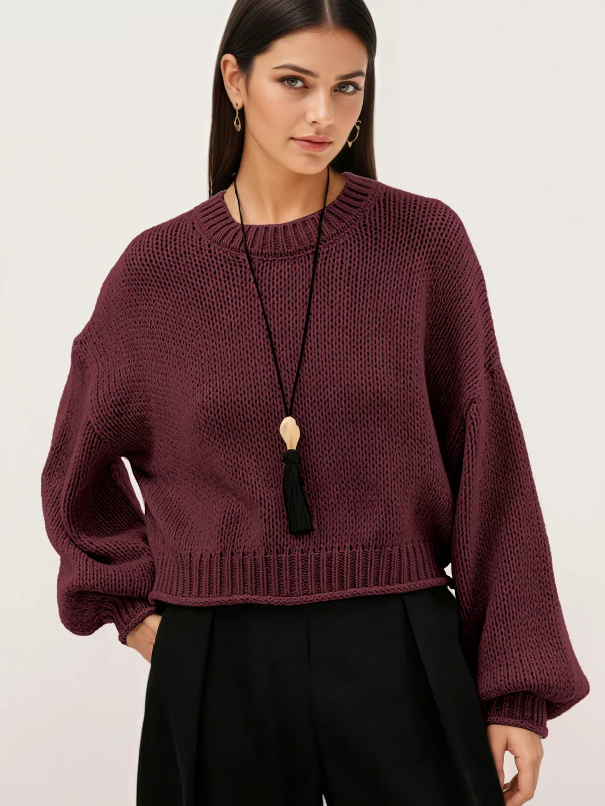 Oversized Chunky Knit Sweater worn with high-waisted jeans, showcasing cozy style and effortless fashion.