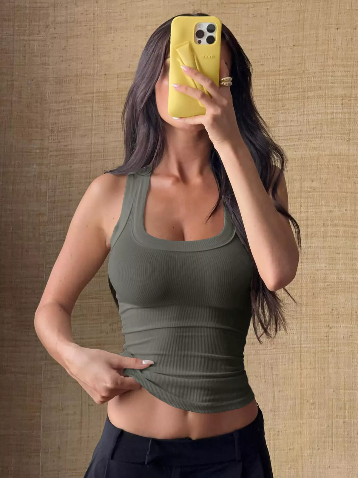 Ribbed Knit Slim Fit Tank Top worn by a model, showcasing the stylish stretch and sleeveless design.