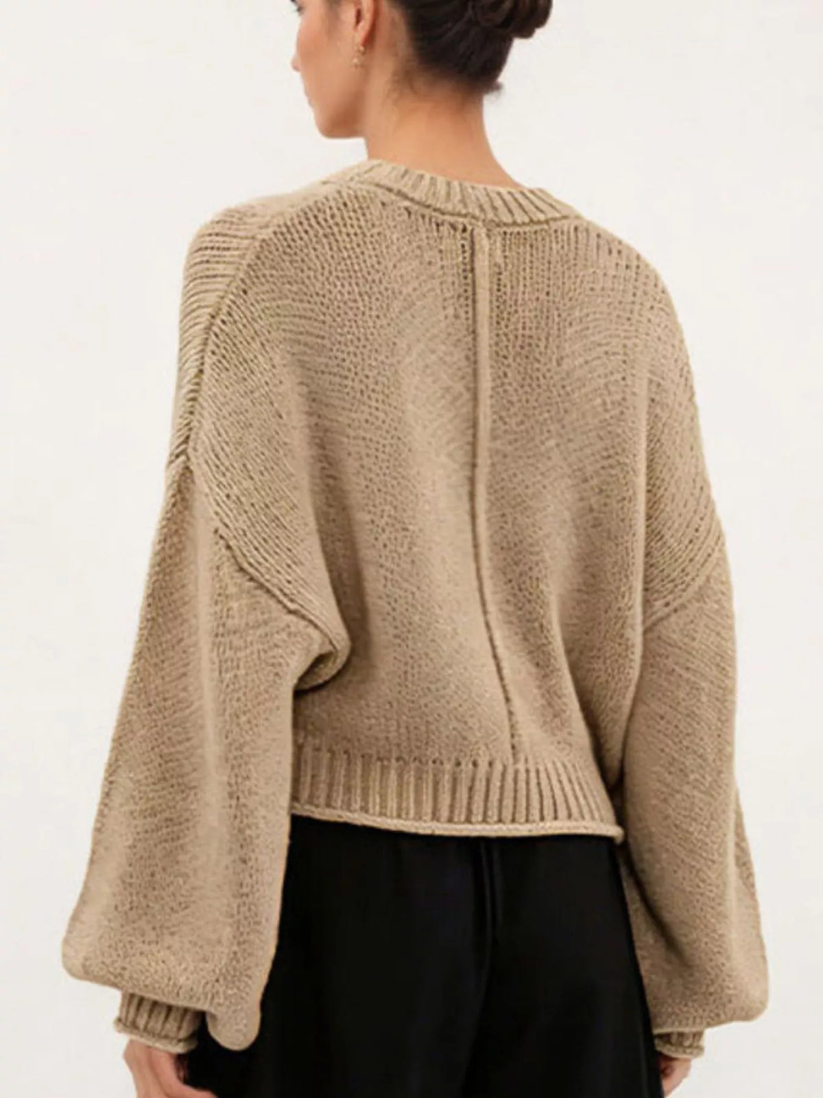Oversized Chunky Knit Sweater worn with high-waisted jeans, showcasing cozy style and effortless fashion.