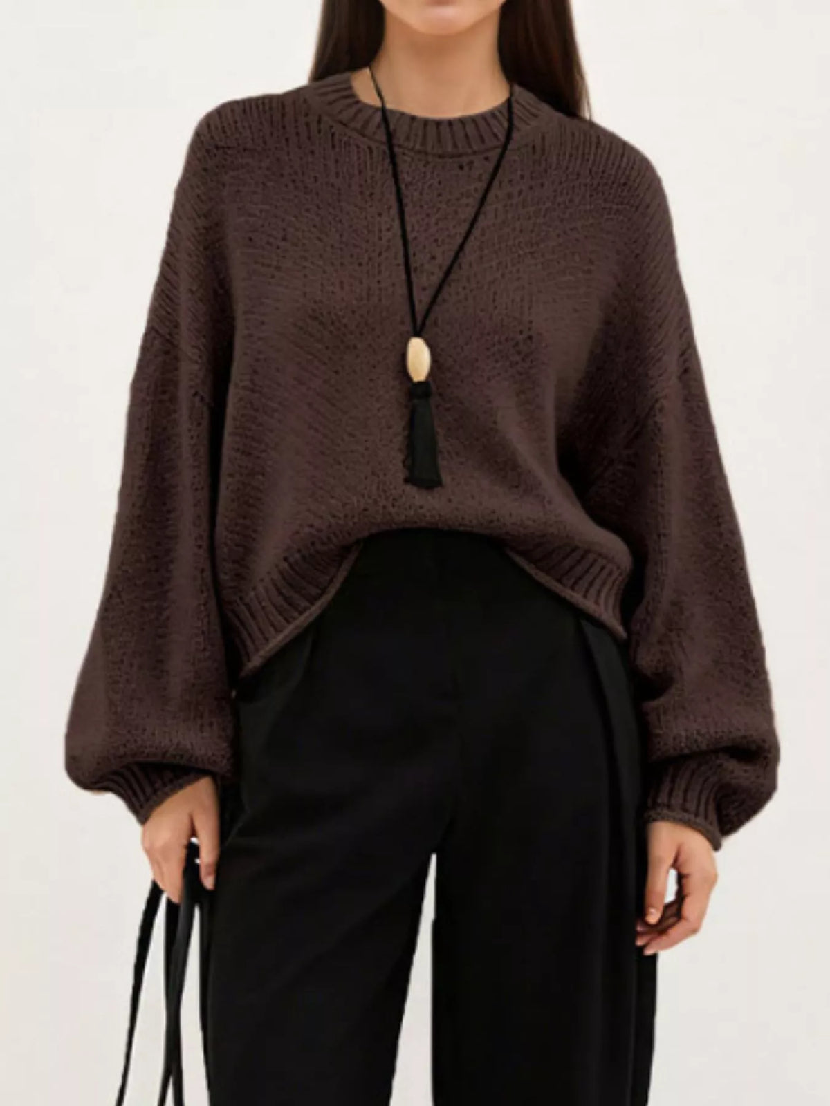 Oversized Chunky Knit Sweater worn with high-waisted jeans, showcasing cozy style and effortless fashion.