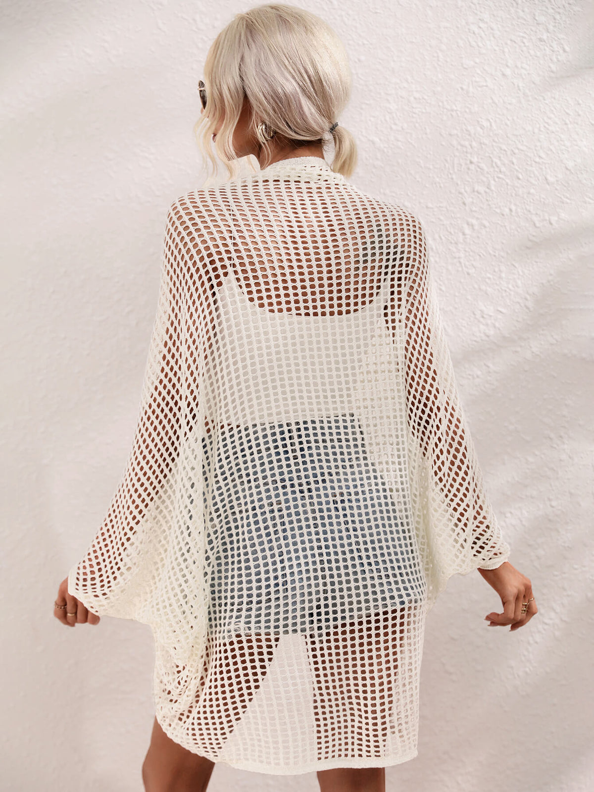Openwork Longline Cover Up worn over a crop top and shorts, showcasing its stylish sheer design.