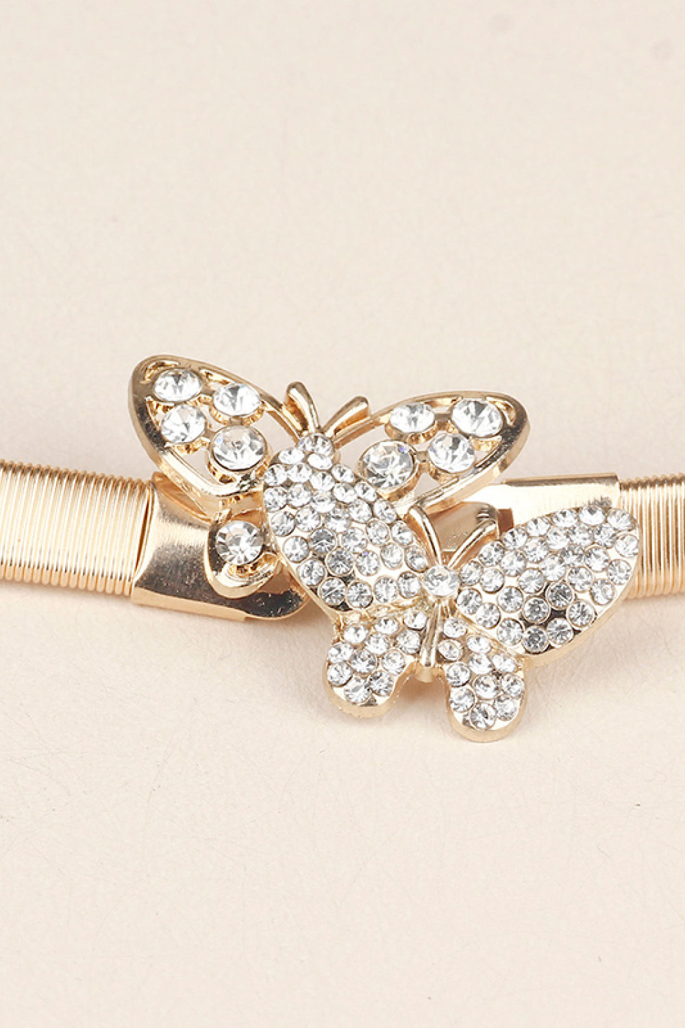 Rhinestone Butterfly Belt featuring a sparkling butterfly design on a gold band, perfect fashion accessory.