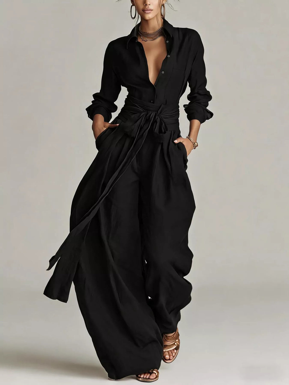Back view of a woman wearing a Long-Sleeve Waist-Tie Jumpsuit in brown, showcasing its elegant design.