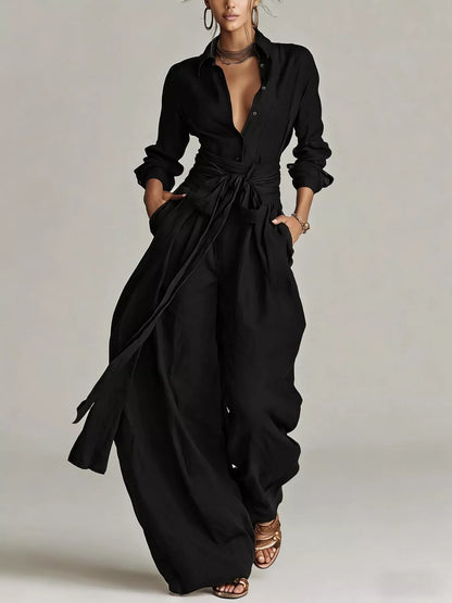 Back view of a woman wearing a Long-Sleeve Waist-Tie Jumpsuit in brown, showcasing its elegant design.