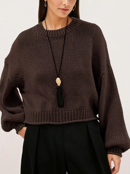 Oversized Chunky Knit Sweater worn with high-waisted jeans, showcasing cozy style and effortless fashion.