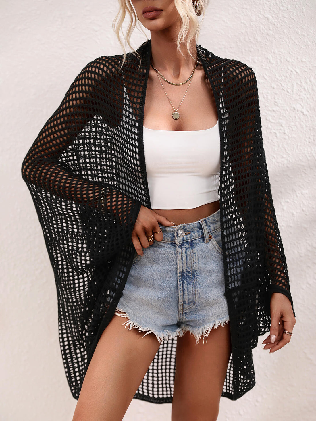 Openwork Longline Cover Up worn over a crop top and shorts, showcasing its stylish sheer design.