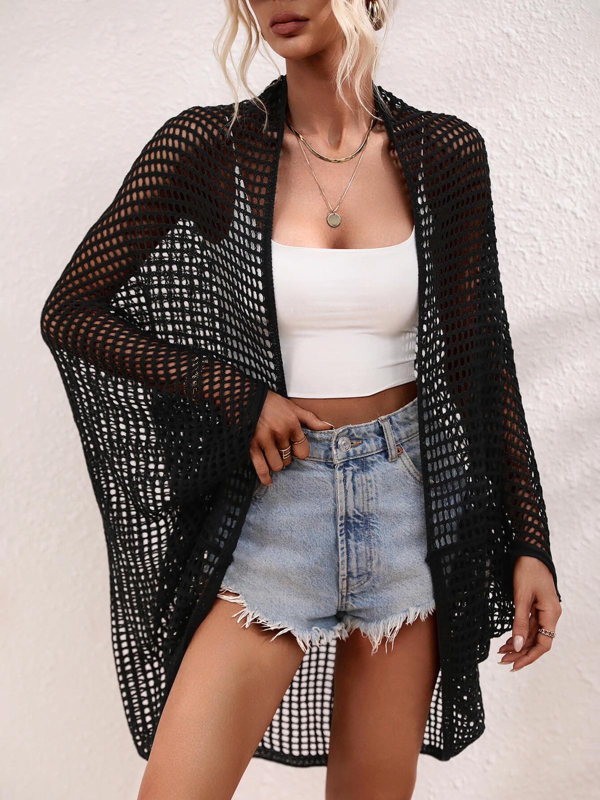 Openwork Longline Cover Up worn over a crop top and shorts, showcasing its stylish sheer design.
