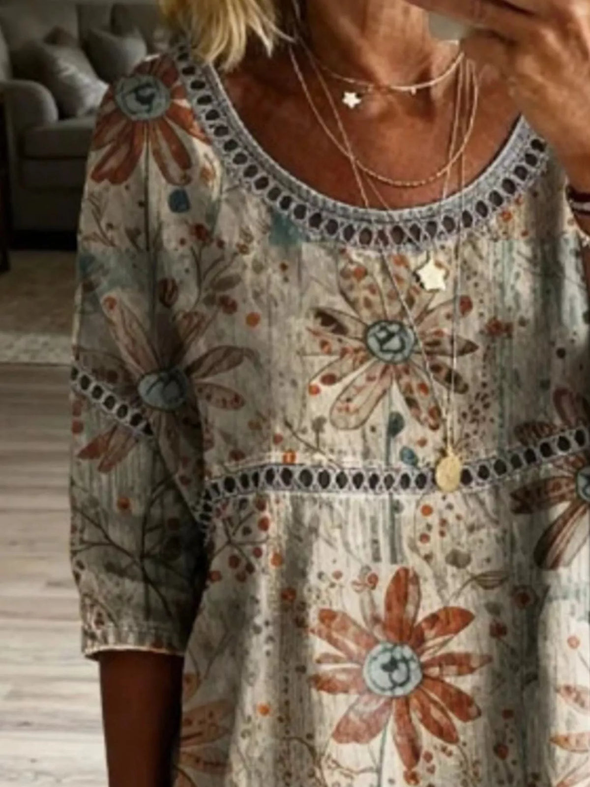 Model wearing a Plus Size Hollow Out Top featuring stylish lace detail and floral pattern.