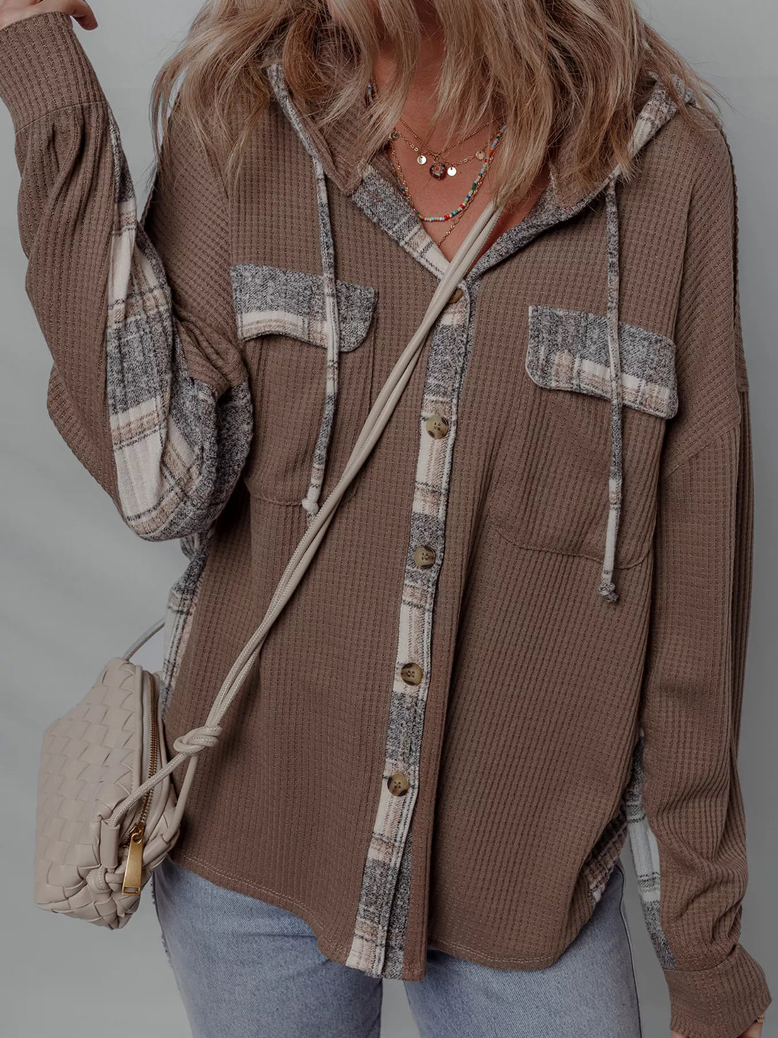 Chic Plaid Hooded Shacket featuring a buttoned front and casual style, perfect for layering.