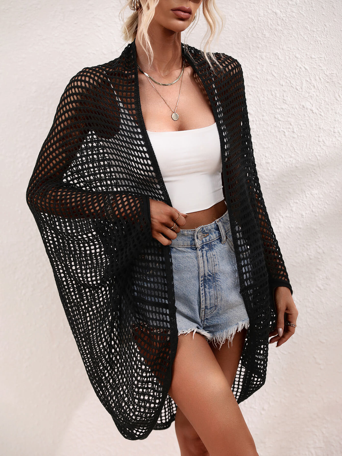 Openwork Longline Cover Up worn over a crop top and shorts, showcasing its stylish sheer design.