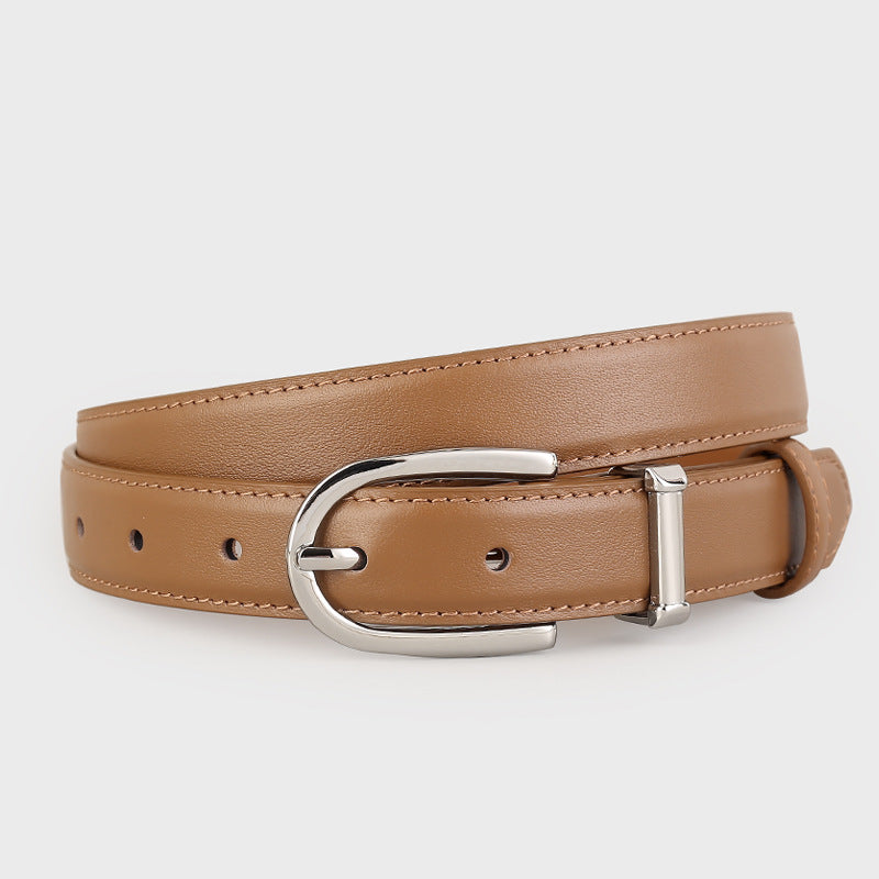 Classic Leather Belt with Silver Buckle held in hand, showcasing its durable construction and polished finish.