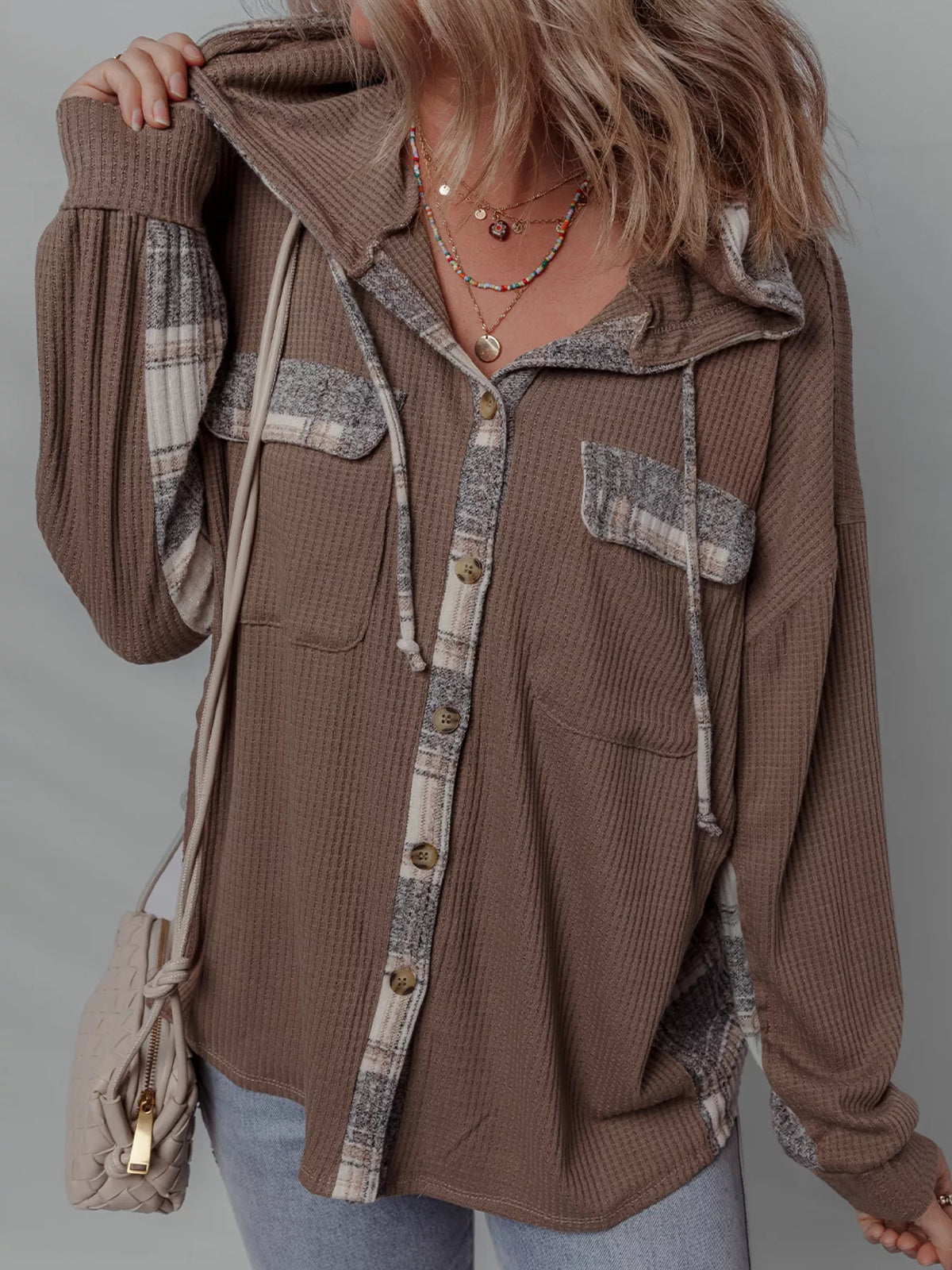 Chic Plaid Hooded Shacket featuring a buttoned front and casual style, perfect for layering.