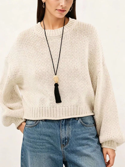 Oversized Chunky Knit Sweater worn with high-waisted jeans, showcasing cozy style and effortless fashion.