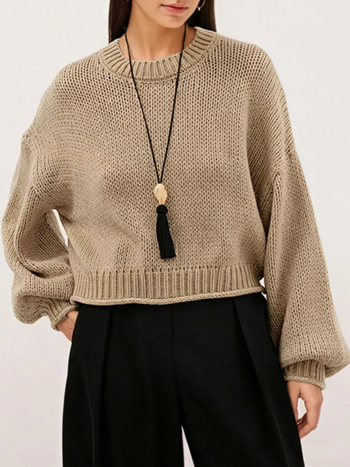 Oversized Chunky Knit Sweater worn with high-waisted jeans, showcasing cozy style and effortless fashion.
