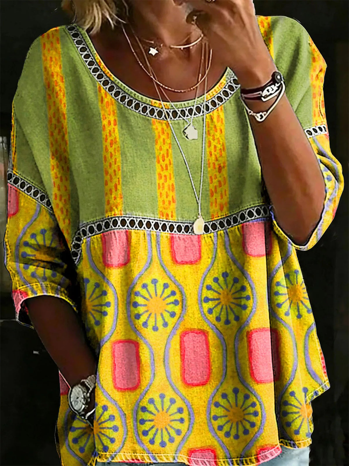 Plus Size Hollow Out Top featuring a vibrant green, yellow, and pink pattern with stylish lace detail.