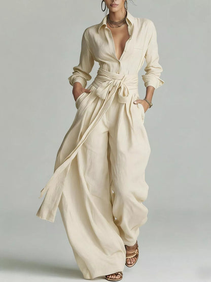 Back view of a woman wearing a Long-Sleeve Waist-Tie Jumpsuit in brown, showcasing its elegant design.