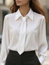 Chic Tie-Neck Blouse in beige with a stylish collar and tie detail, perfect for elegant women&