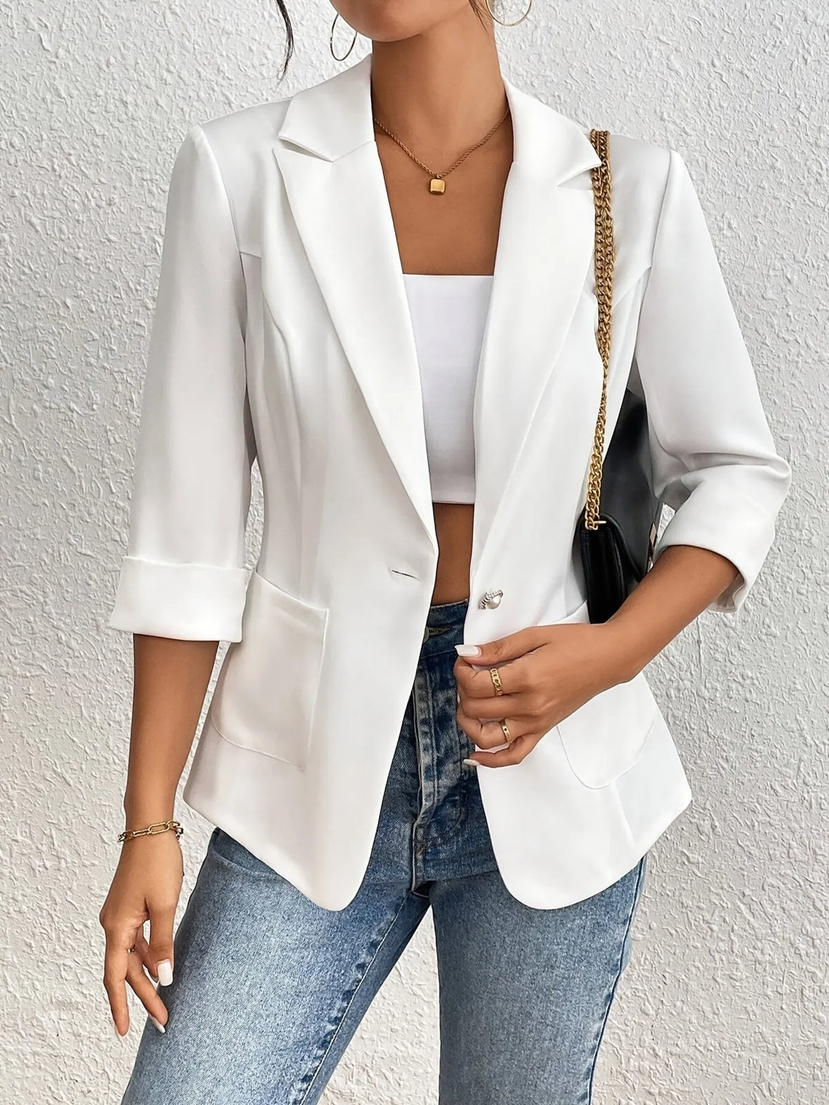 Back view of a woman wearing a Classic Lapel Collar Blazer, showcasing its elegant design and sophisticated style.