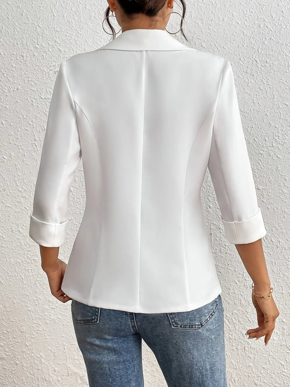 Back view of a woman wearing a Classic Lapel Collar Blazer, showcasing its elegant design and sophisticated style.