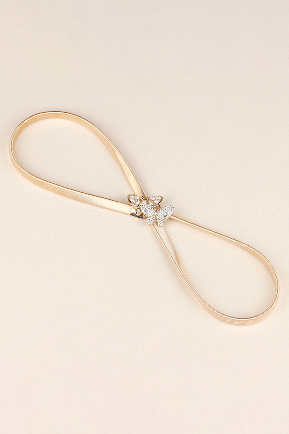 Rhinestone Butterfly Belt with golden strap and sparkling butterfly embellishments for stylish outfits.