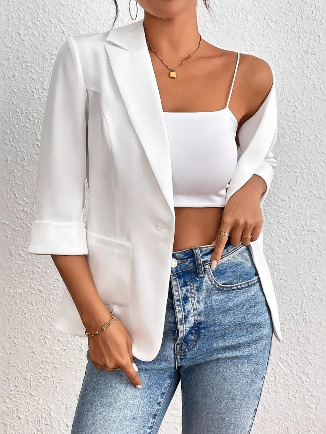 Classic Lapel Collar Blazer worn over a white crop top with high-waisted jeans, showcasing elegant style and sophistication.