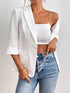 Classic Lapel Collar Blazer worn over a white crop top with high-waisted jeans, showcasing elegant style and sophistication.