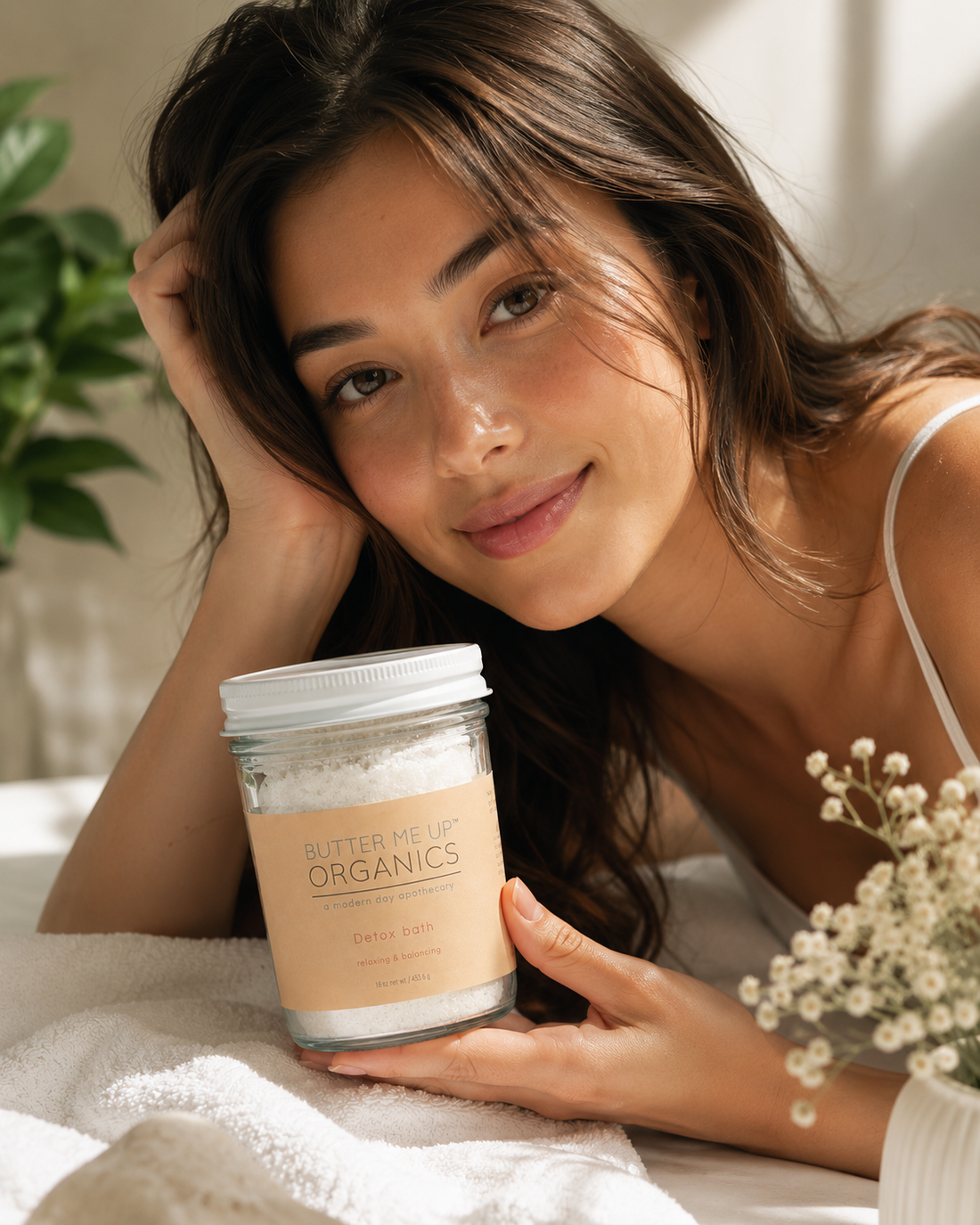 Woman relaxing with Detox Bath Soak with Essential Oils from Butter Me Up Organics.