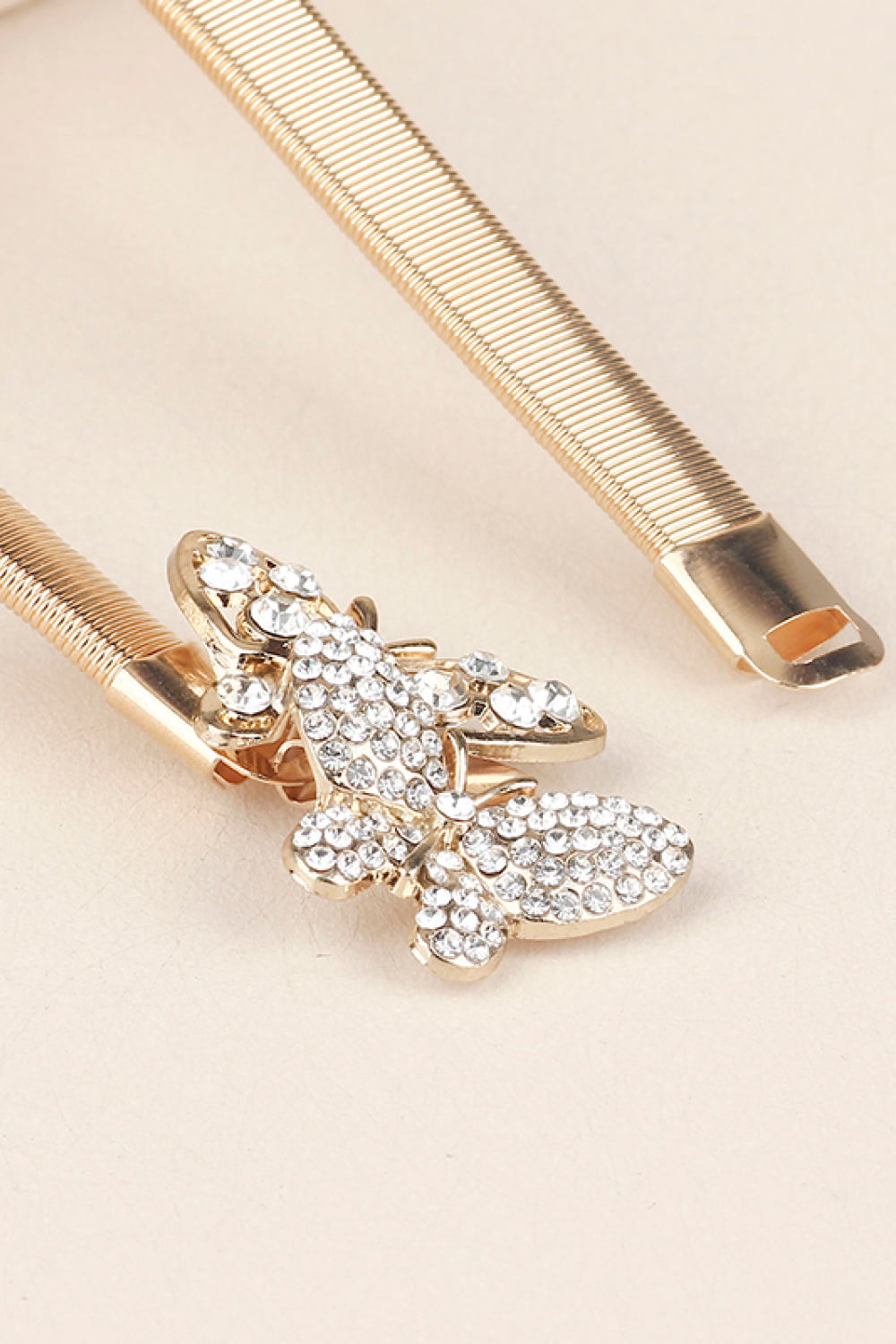 Rhinestone Butterfly Belt with golden strap and sparkling butterfly embellishments for stylish outfits.