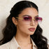 Rimless Gradient Tinted Sunglasses worn by a woman with dark hair and pearl earrings