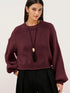 Oversized Chunky Knit Sweater worn with high-waisted jeans, showcasing cozy style and effortless fashion.