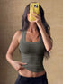 Ribbed Knit Slim Fit Tank Top worn by a model, showcasing the stylish stretch and sleeveless design.