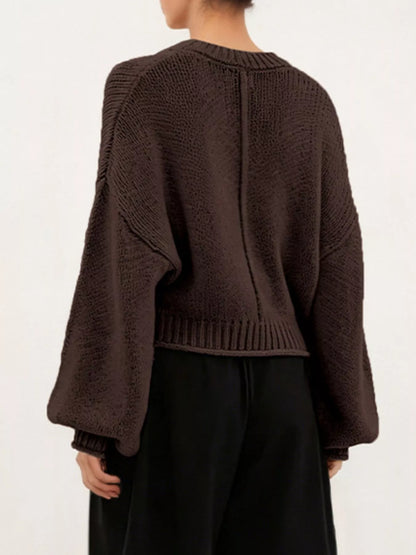 Oversized Chunky Knit Sweater worn with high-waisted jeans, showcasing cozy style and effortless fashion.