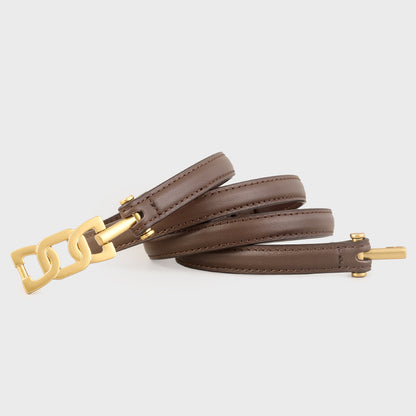 Gold Buckle Skinny Leather Belt showcased in black leather with a stylish gold buckle design.