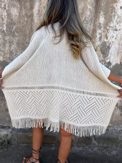 Fringe Open Front Cardigan worn by a woman, styled with denim shorts and a black top, showcasing its chic and comfortable design.