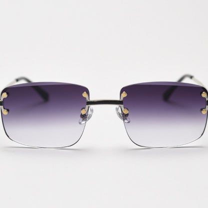 Rimless Gradient Tinted Sunglasses worn by a woman with dark hair and pearl earrings