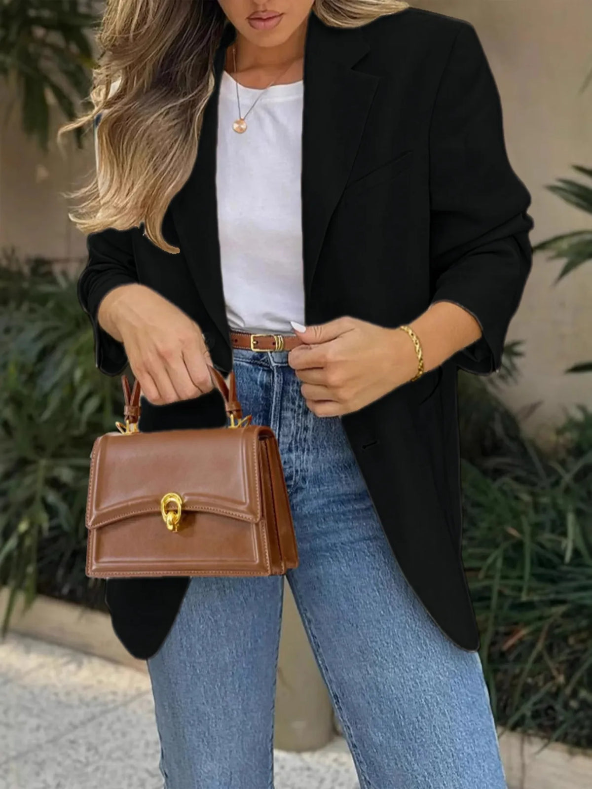 Model wearing a Pocketed Lapel Collar Long Sleeve Blazer with jeans and a stylish handbag.