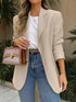 Model wearing a Pocketed Lapel Collar Long Sleeve Blazer with jeans and a stylish handbag.