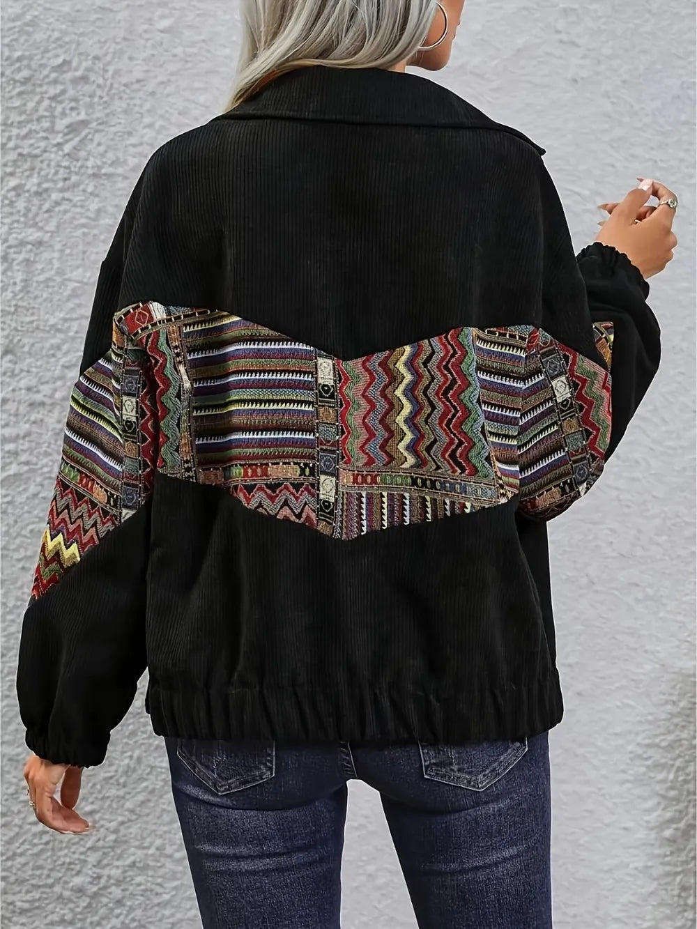 Back view of Embroidered Collared Snap Down Jacket showcasing colorful patterned detailing.