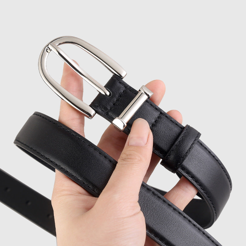 Classic Leather Belt with Silver Buckle held in hand, showcasing its durable construction and polished finish.