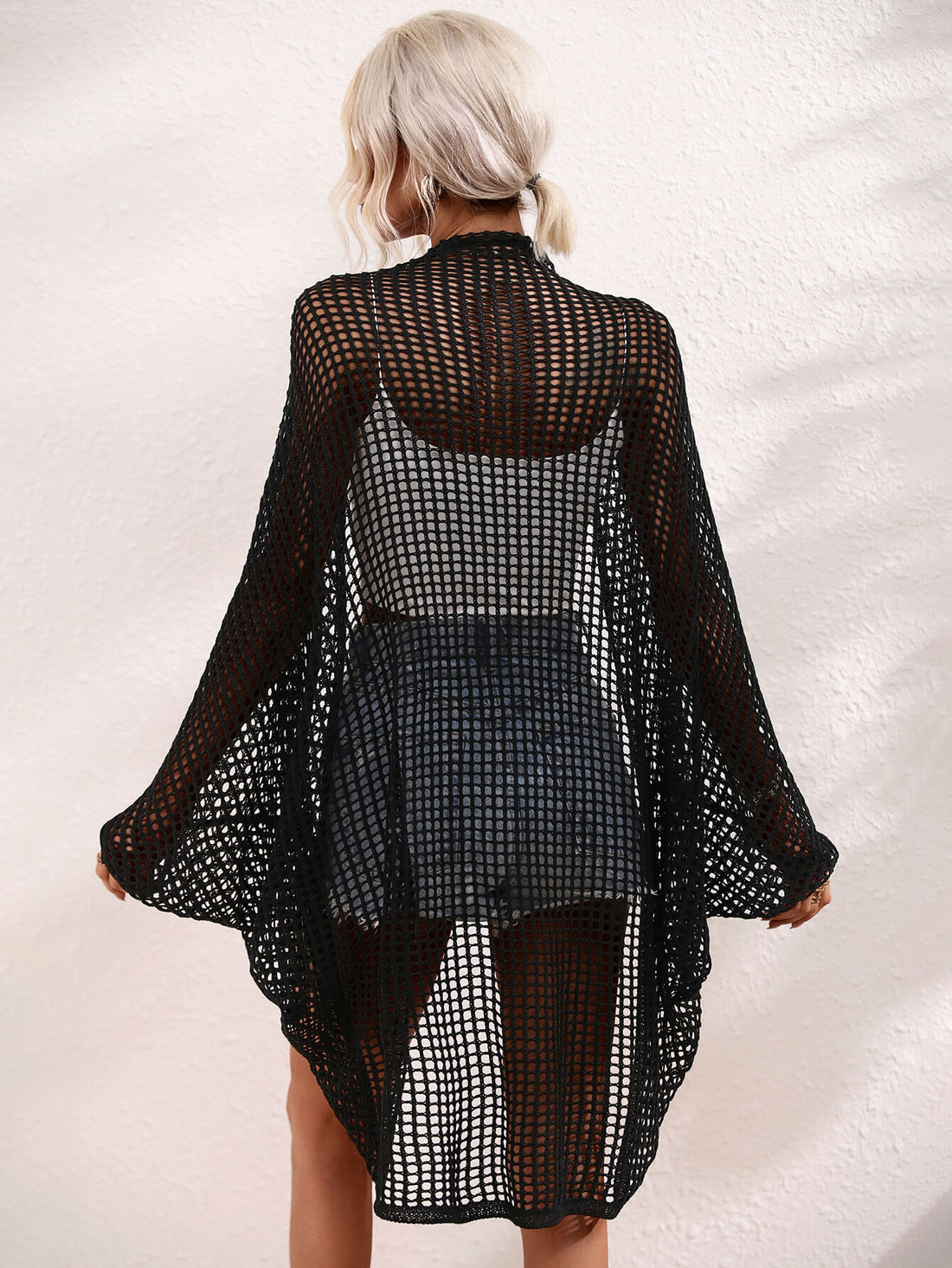 Openwork Longline Cover Up worn over a crop top and shorts, showcasing its stylish sheer design.