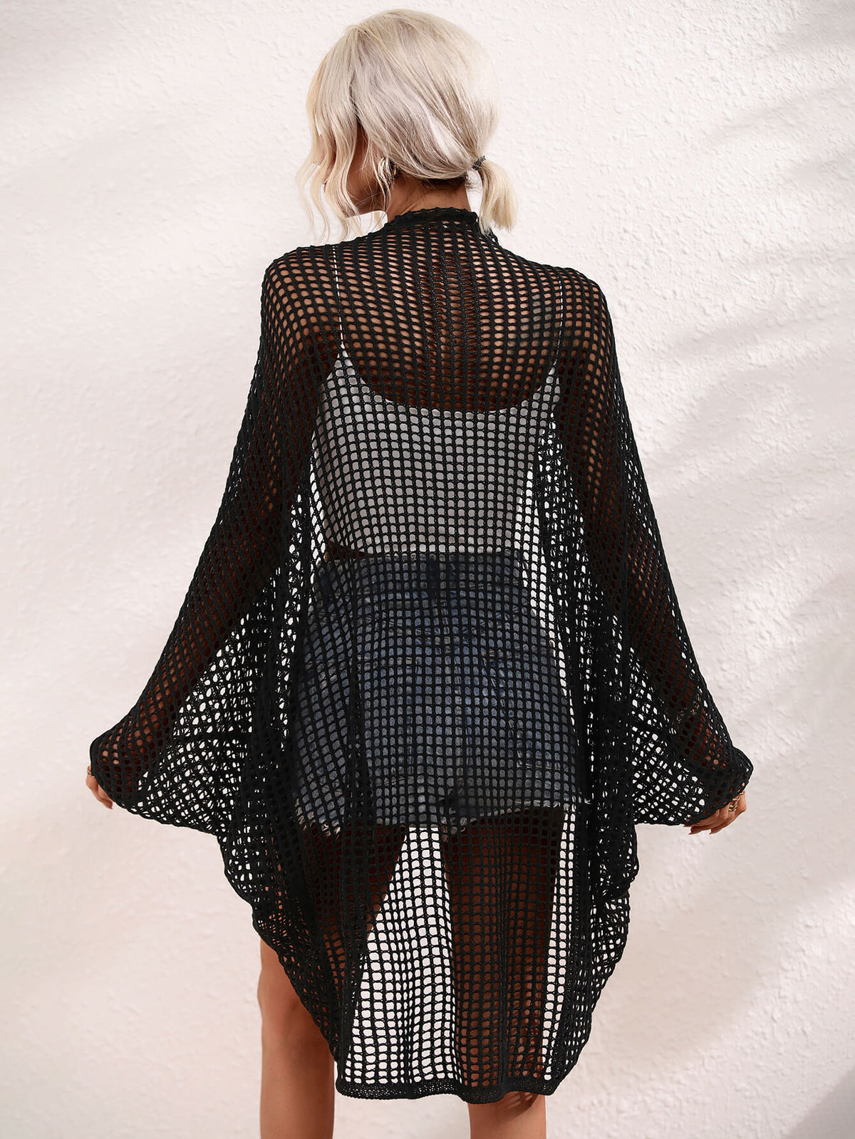 Openwork Longline Cover Up worn over a crop top and shorts, showcasing its stylish sheer design.
