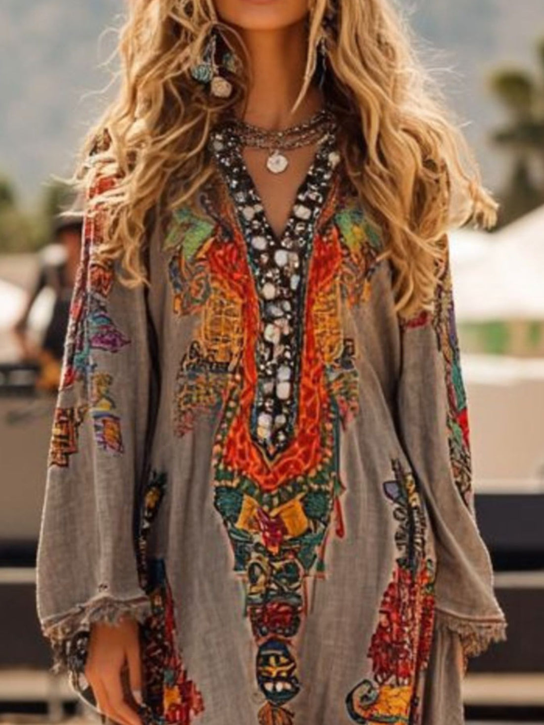 Fringe Hem Notched Long Sleeve Dress featuring colorful embroidery and intricate beading details.